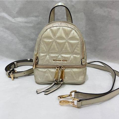 amazon michael kors mini backpack Jaycee MK Signature Convertible - XS Its smooth coated textile and gold studs give it a modern and refined style Jaycee Extra-Small Signature Logo Backpack