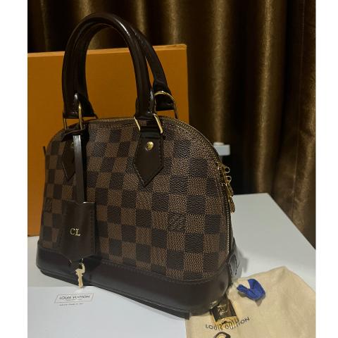 Alma cloth handbag Louis Vuitton Brown in Cloth - 31959861