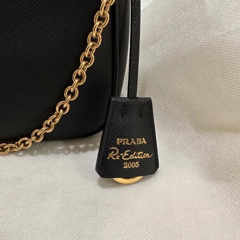 Prada Leather Cross Body Bag Black Gold Re-Edition 2005 Saffiano Leather Bag  – The Luxury Shopper