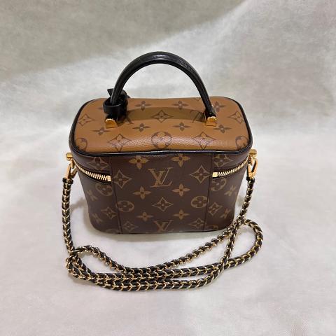 Vanity cloth handbag Louis Vuitton Brown in Cloth - 25307986