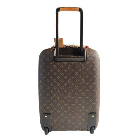 Lot - A Louis Vuitton monogrammed canvas 'Pegase Legere 55' cabin / trolley  bag suitcase vachetta leather handles