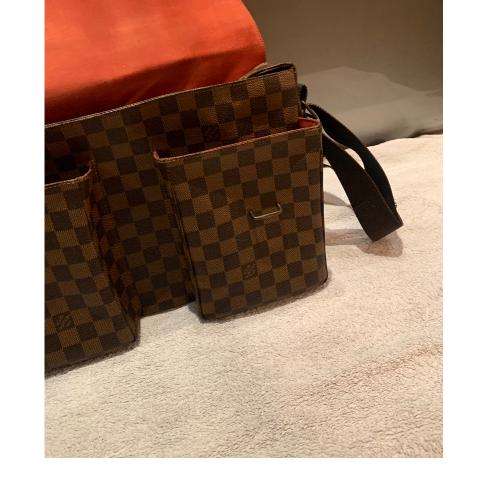 Louis Vuitton Damier Ebene Highbury, in brown and tobacco Louis Vuitton monogram  coated canvas, the brass zipper closure opening to sold at auction on  11th September