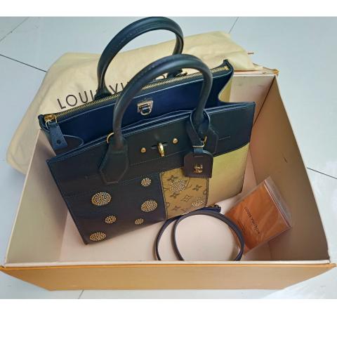 City Streamer PM python leather handbag by Louis Vuitton is our