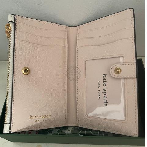 Comparison of Kate Spade's small Leila wallet and the Coach small